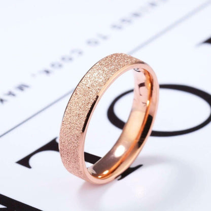 Sparkly wedding rings crafted from rose gold Tungsten with a shimmering finish.