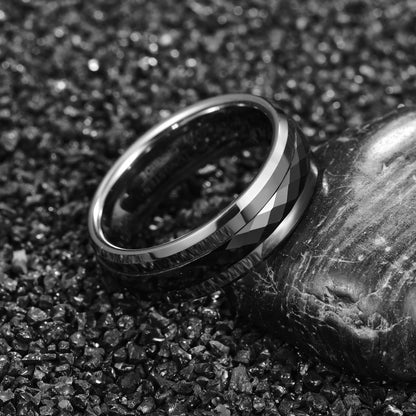 Spin ring, featuring a silver band with a faceted black spinner.