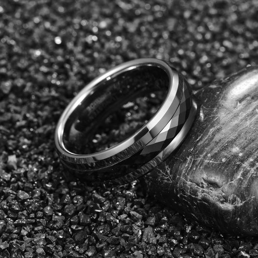 Spin ring, featuring a silver band with a faceted black spinner.