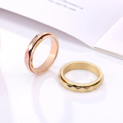 Spinner rings for women, featuring a faceted rotating band.