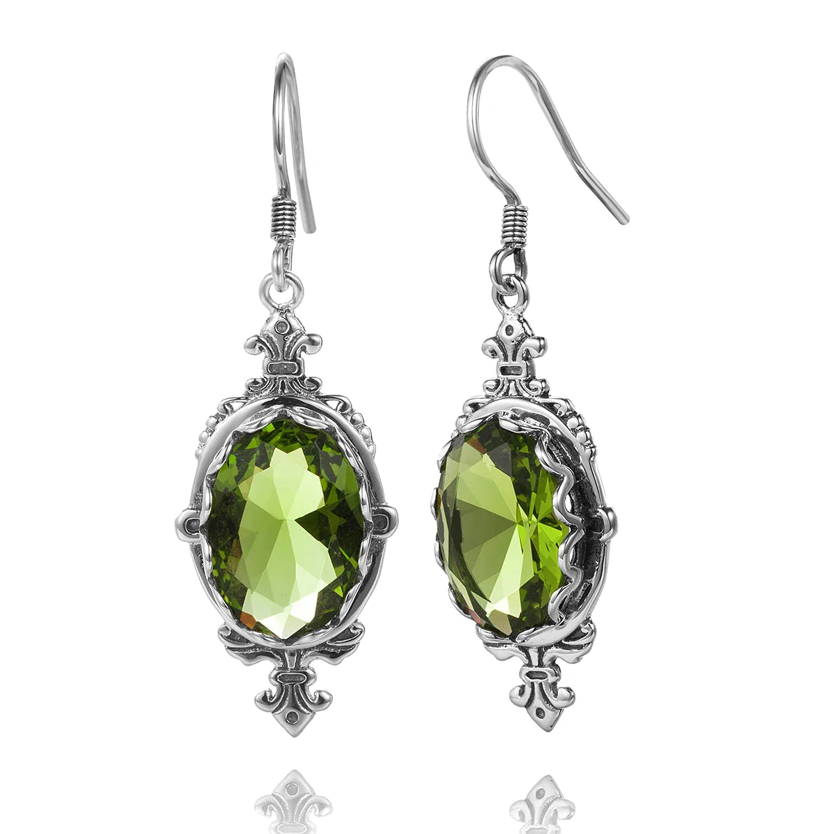 Sterling silver hook earrings with ornate vintage silverwork surrounding natural green peridot stones.