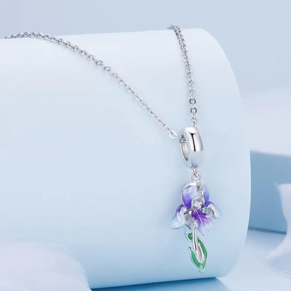 Sterling silver purple iris necklace with a graceful botanical design and included chain.
