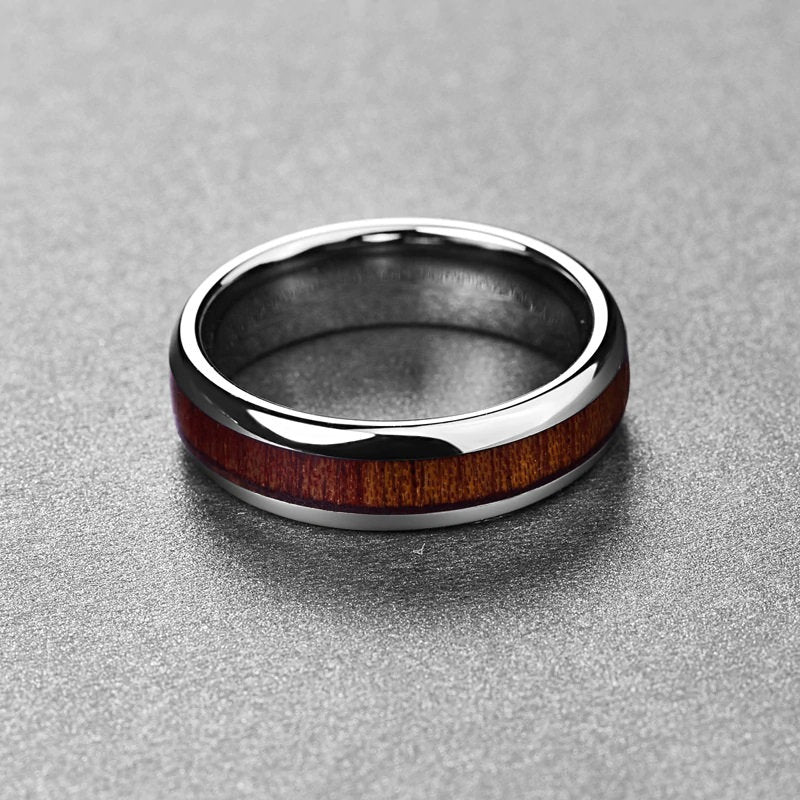 Tungsten koa wood wedding band with a domed design and smooth polished edges.