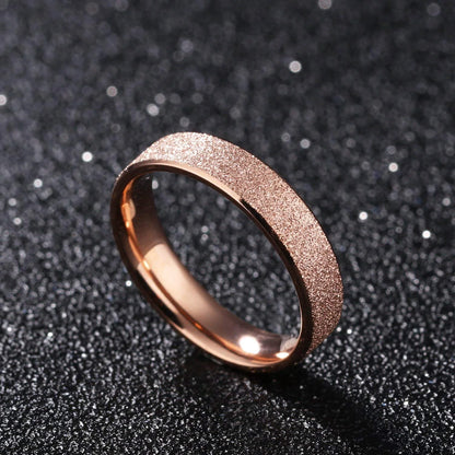 Women's rose gold wedding ring with a sparkly sandblasted exterior.