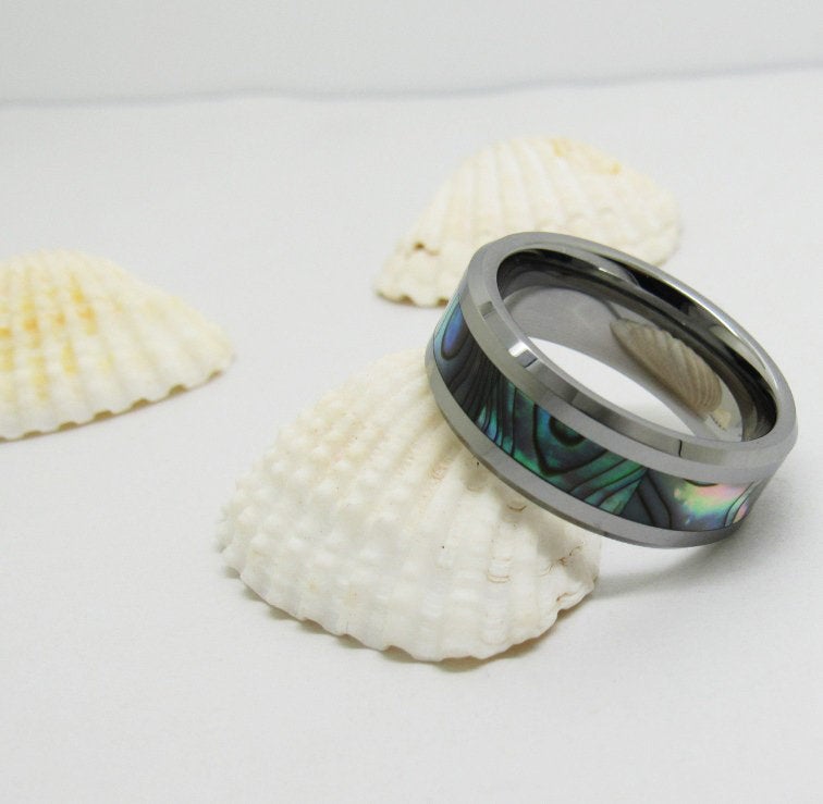 Abalone beveled edges band crafted from silver Tungsten with a rainbow shell inlay.