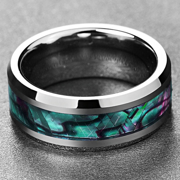 Abalone inlay on a silver Tungsten ring featuring iridescent blue and pink colors.