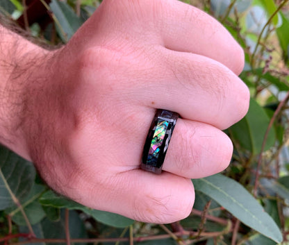 Abalone jewelry ring in black Tungsten with faceted edges.