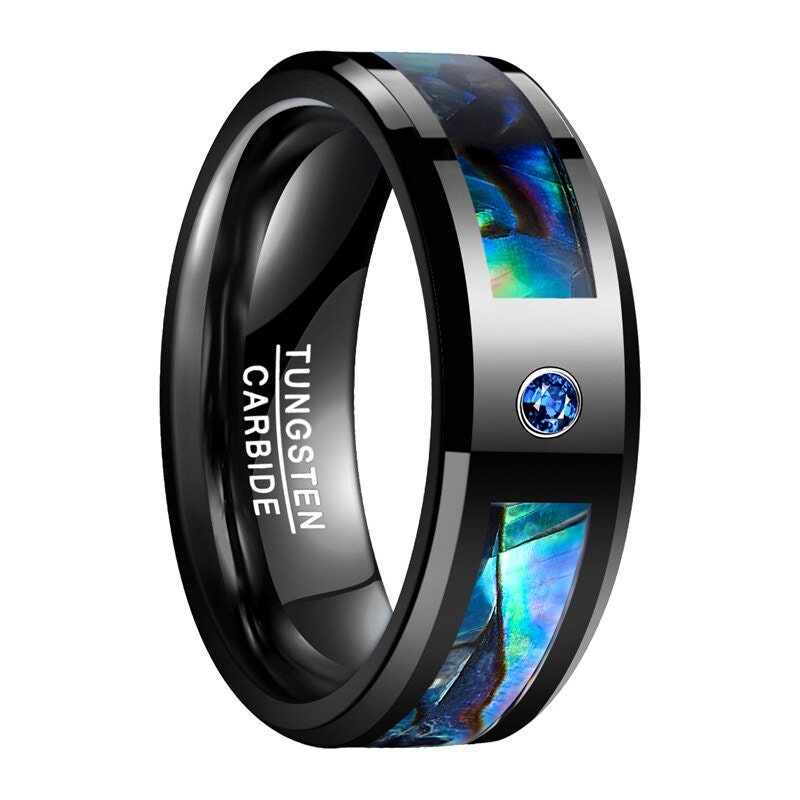 Abalone ring mens with a black Tungsten band, abalone inlay, and a blue stone.