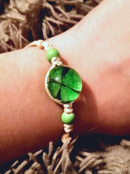 Adjustable botanical bracelet with a real preserved plant specimen set beneath clear glass.