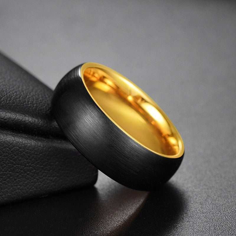 Black and gold mens wedding ring with a black Tungsten exterior and gold interior.