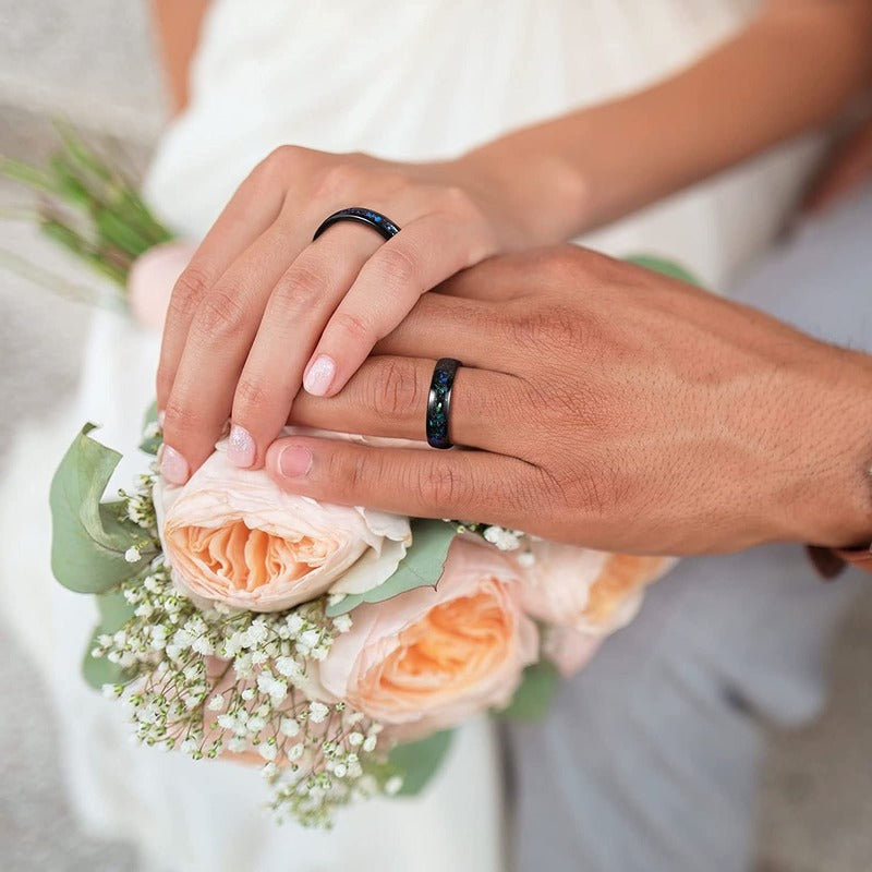 Black Tungsten cosmos ring shown worn on hand.