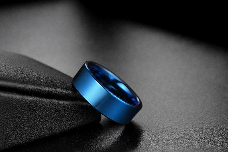 Blue wedding rings featuring an 8mm flat band crafted from blue Tungsten.