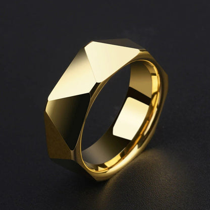 Geometric ring crafted with gold Tungsten, displayed on a black surface.