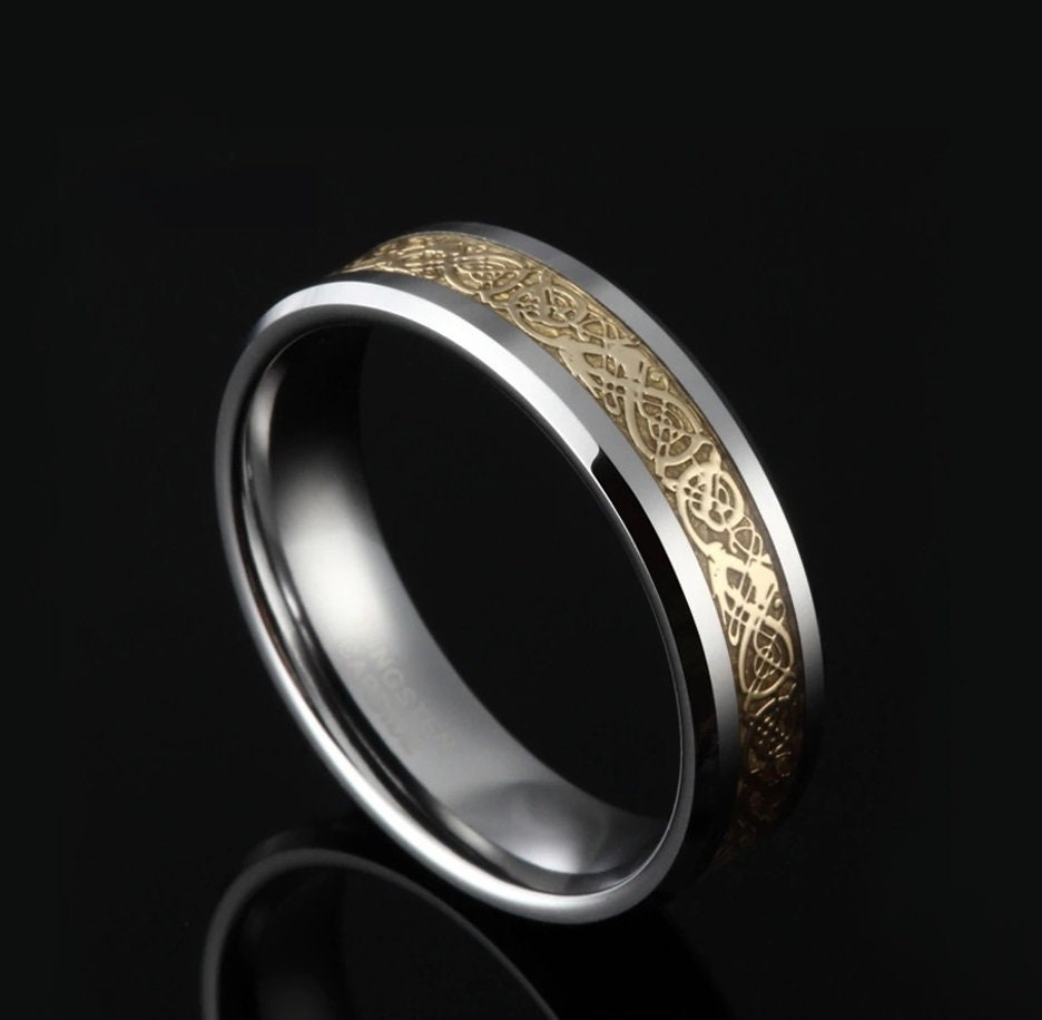 Gold dragon ring with silver Tungsten and Celtic inlay.