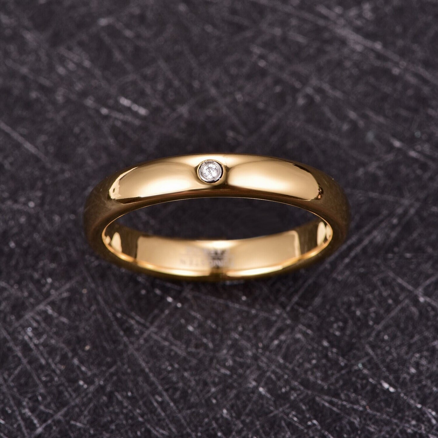 Gold gypsy ring with comfort fit design, featuring a domed band and cubic zirconia.