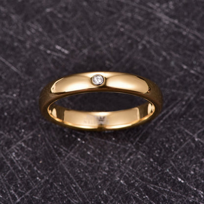 Gold gypsy ring with comfort fit design, featuring a domed band and cubic zirconia.