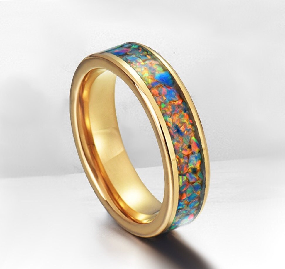 Gold opal ring with rainbow opal inlay and polished finish, 6mm width.