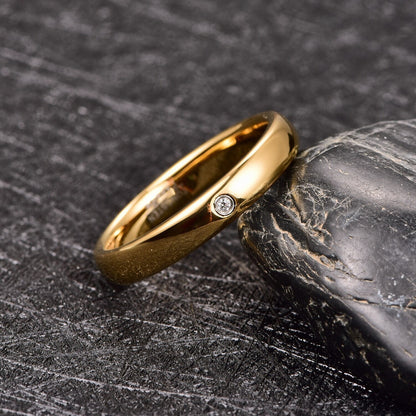 Gypsy ring in gold Tungsten with flush set cubic zirconia and domed band.