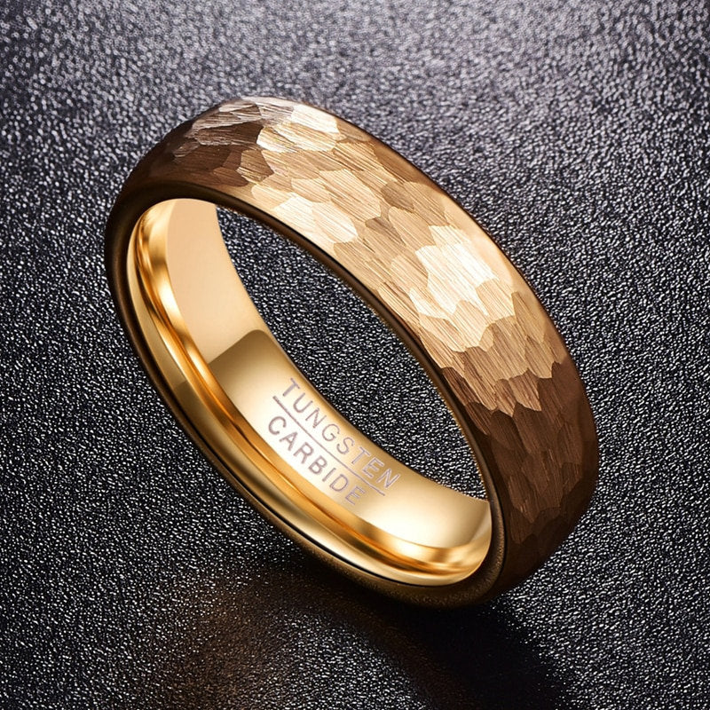 Hammered gold ring with a 6mm gold Tungsten band and textured exterior.