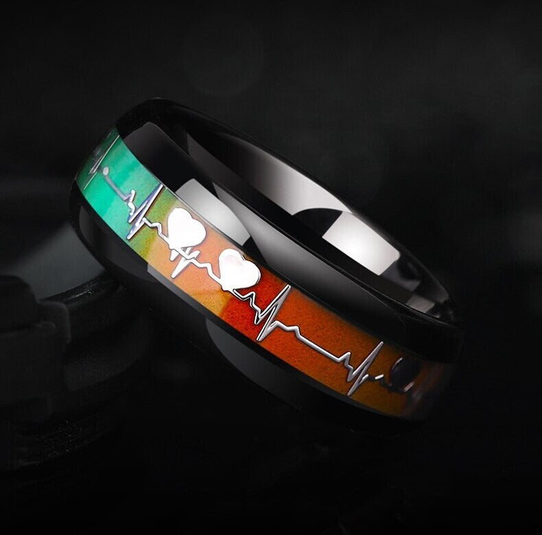 Heartbeat ring with color-changing design in a polished black Tungsten band.