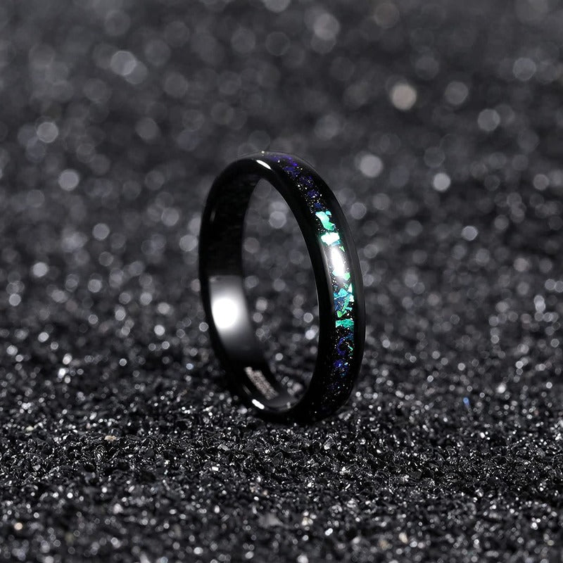 Holographic wedding ring with black Tungsten and an iridescent inlay.