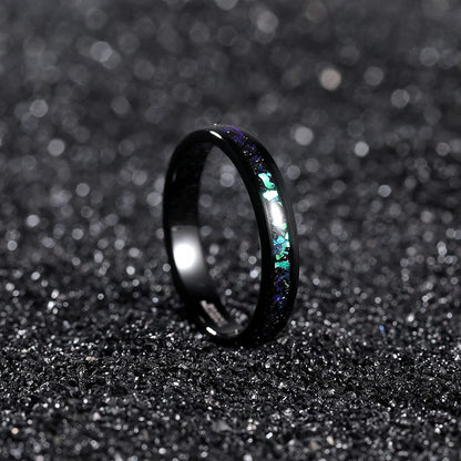 Holographic wedding ring with black Tungsten and an iridescent inlay.