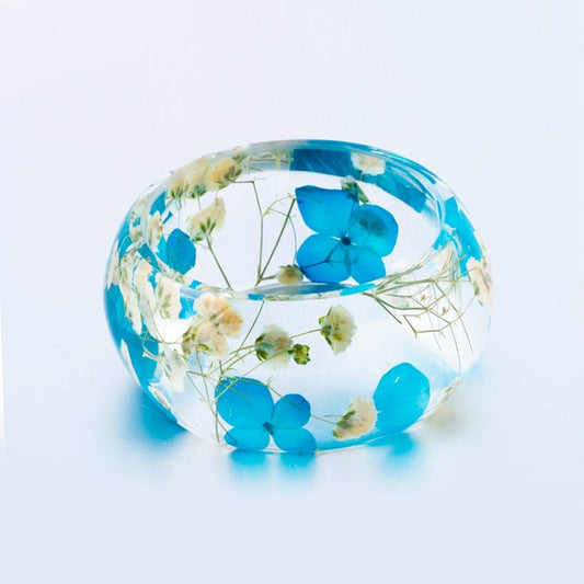 Bracelet jonc hortensia bleu et fleur de souffle de bébé blanc