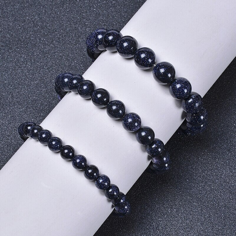 Bracelet en pierre dorée bleue scintillante