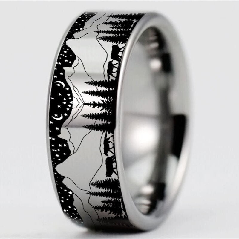 Jewelry with wolves featuring a Tungsten band with a forest and mountain design.