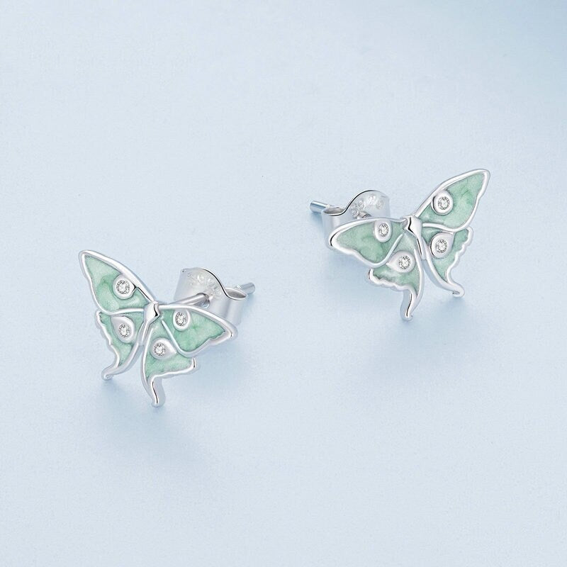 Luna moth earrings featuring a soft woodland-inspired design.