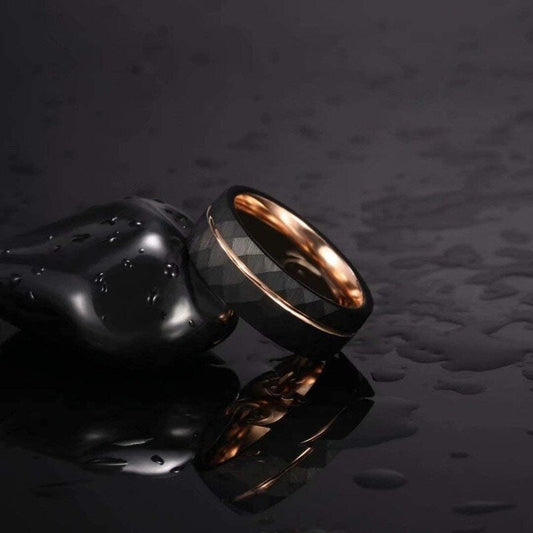 Mens black wedding band with rose gold and polished interior.