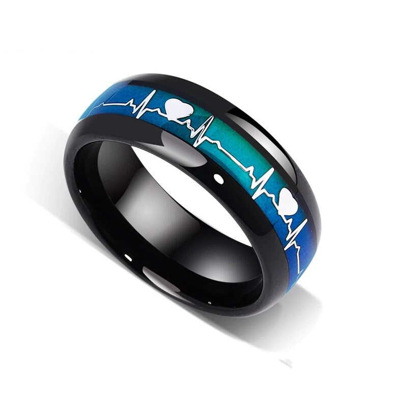 Mens mood ring with blue heartbeat pattern on polished black Tungsten.