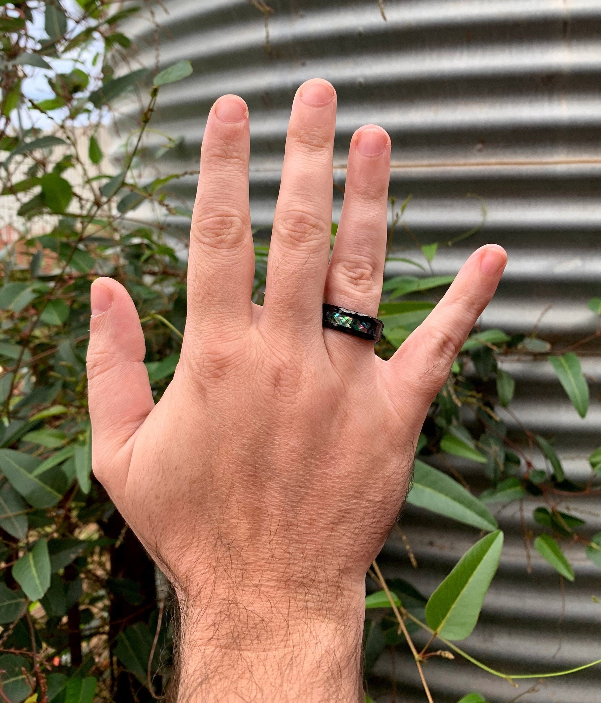 Mens ocean ring with abalone shell inlay on black Tungsten band.