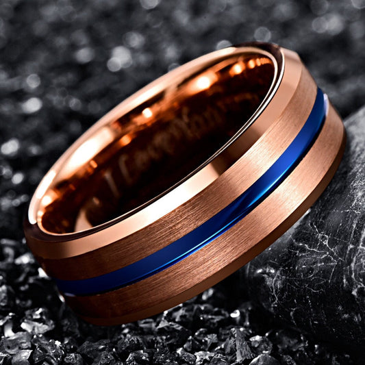 Modern wedding rings crafted from rose gold Tungsten with a bold blue stripe.