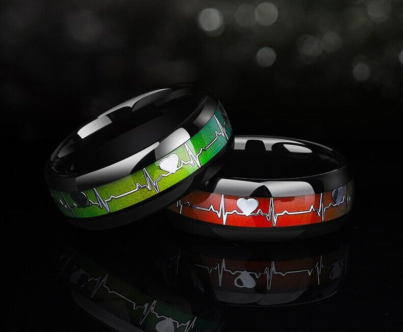 Mood rings for men with green and red heartbeat designs in Tungsten bands.