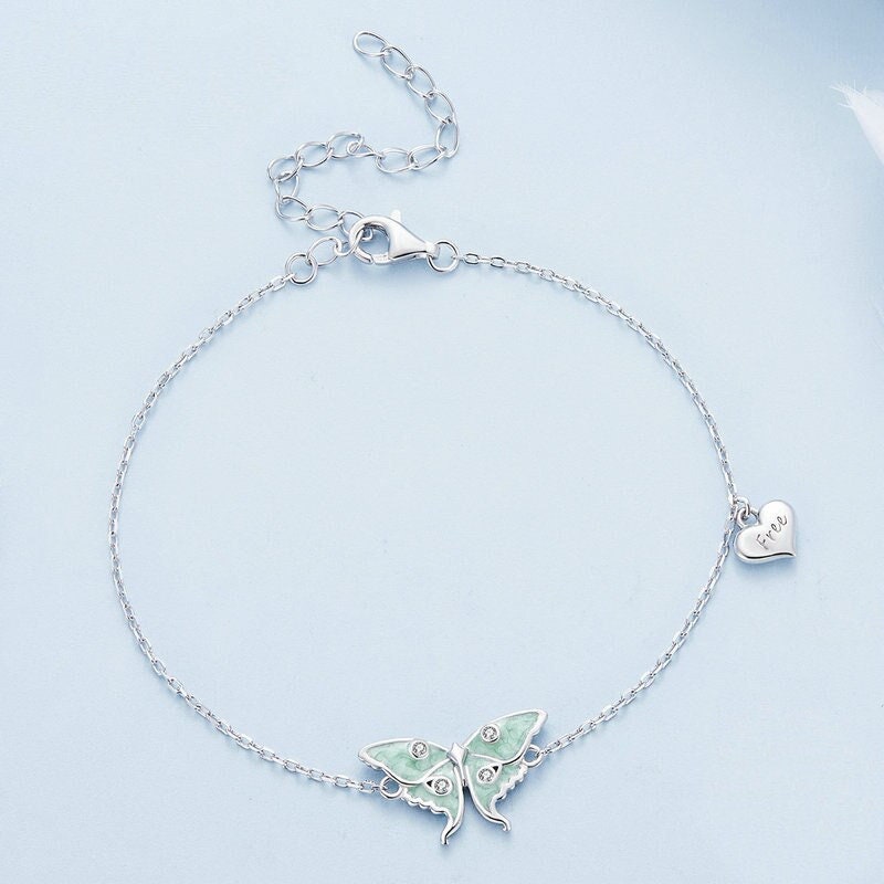 Moth bracelet featuring a pale green luna moth.