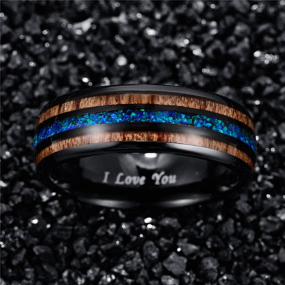 Opal mens ring with a black Tungsten band, blue-green opal, and wood inlay.