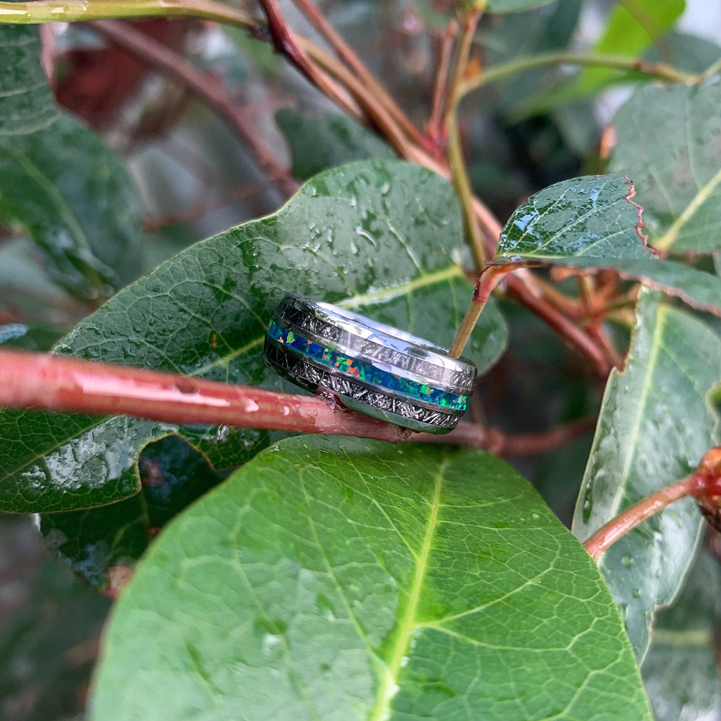 Opal rings for men with polished silver Tungsten, showcasing opal and meteorite inlays.