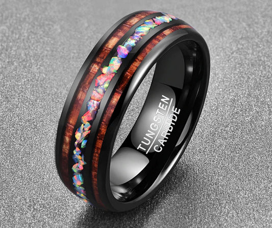 Opal wedding ring with a black Tungsten band inlaid with natural opal and Koa wood.