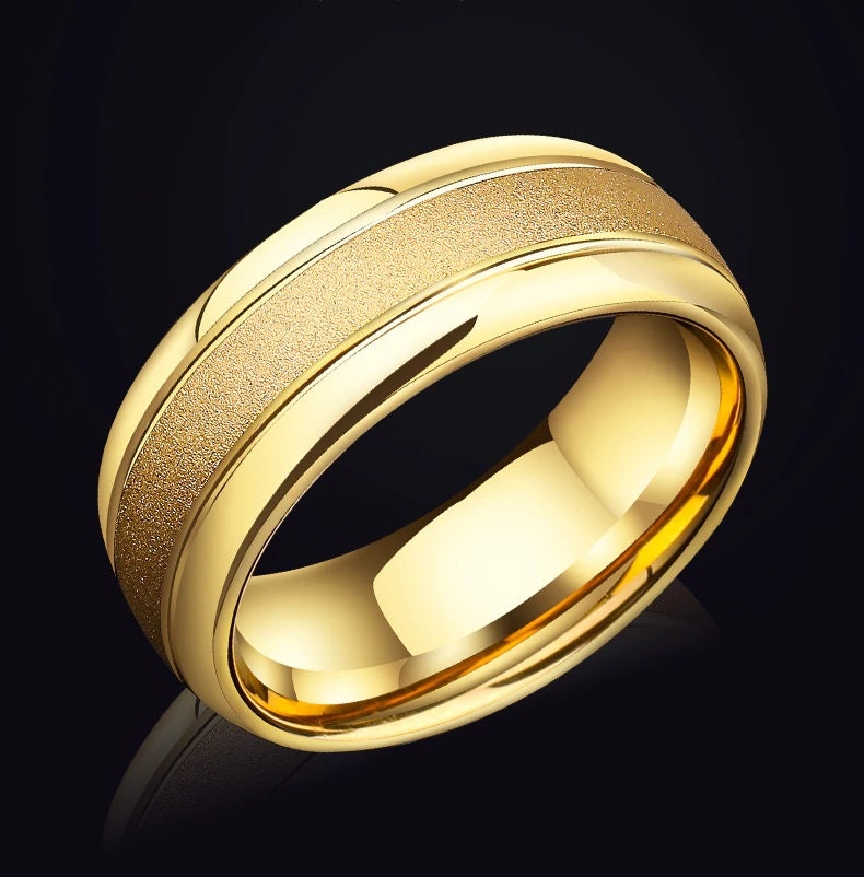 Tungsten gold mens wedding rings with a textured inlay and comfort fit.