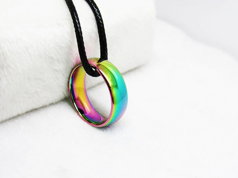 Rainbow wedding ring dome-shaped Tungsten band with iridescent finish.