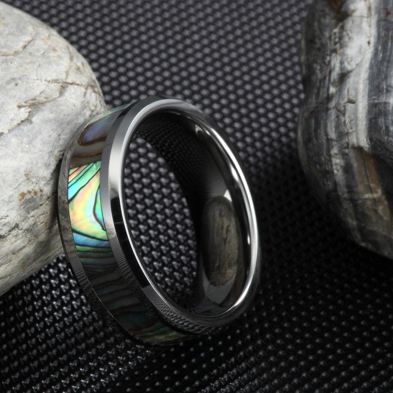 Sea themes wedding rings with a silver Tungsten band and vibrant abalone shell inlay.