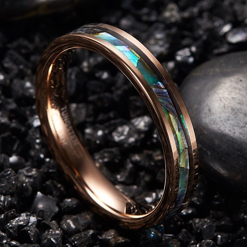 Shell rings crafted with polished rose gold Tungsten and a vibrant abalone shell inlay.