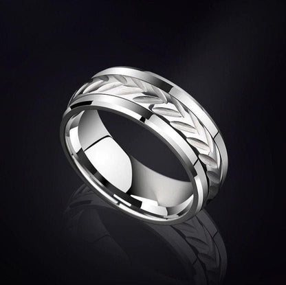 Silver Tungsten men's spinner wedding ring featuring an etched leaf center design and polished edges.