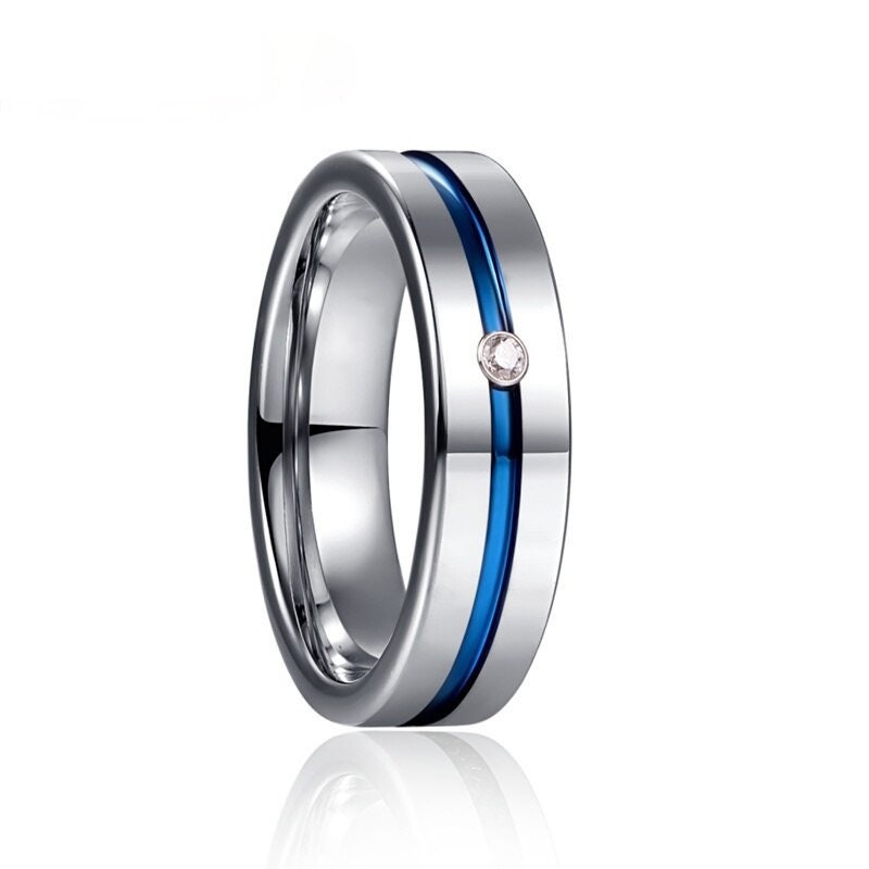 Silver and blue Tungsten ring with comfort fit, flat band, and flush-set cubic zirconia.