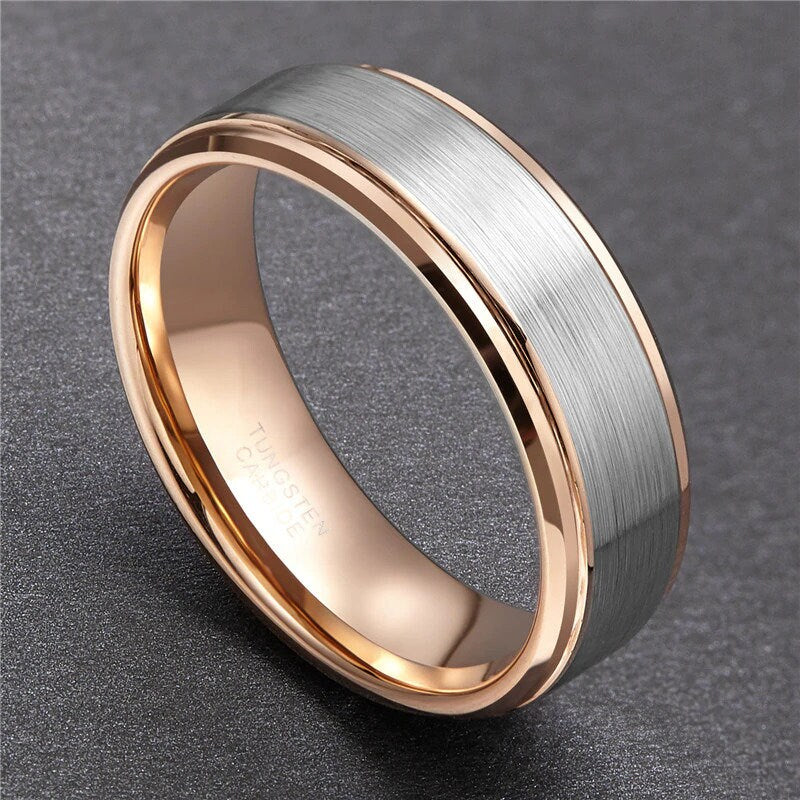 Silver and rose gold ring with comfort fit, brushed exterior, and stepped edges.