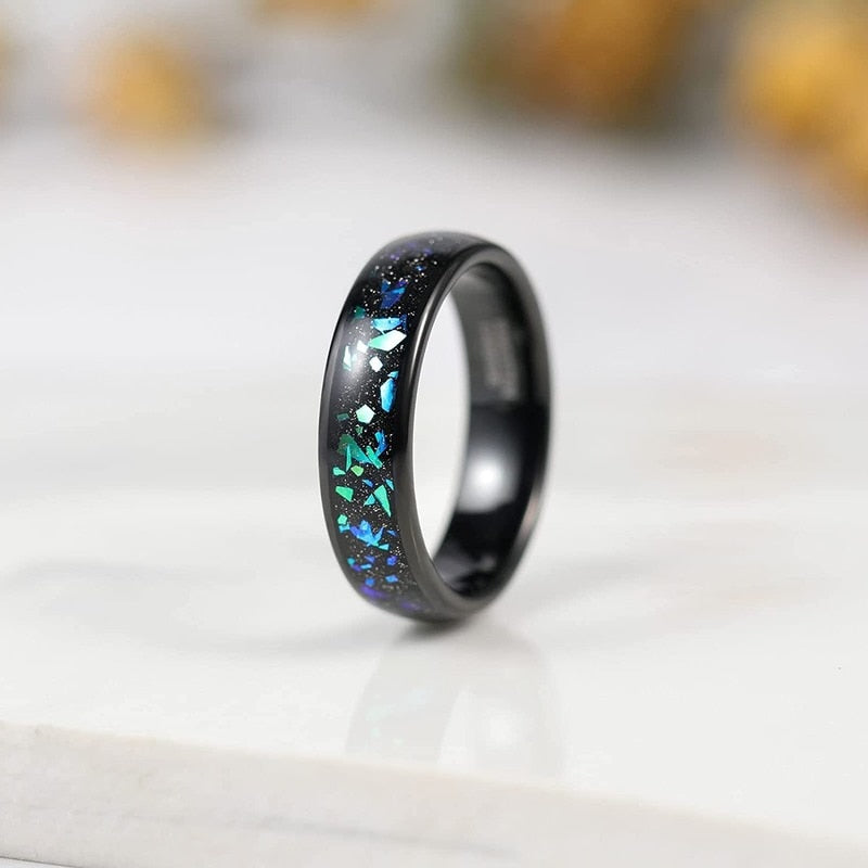 Space ring featuring a black Tungsten band with a galaxy inlay.