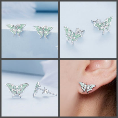 Sterling silver luna moth studs with clear cubic zirconias sparkling across the delicate wings.