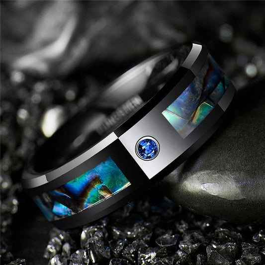 Stone rings for men with a black Tungsten band, abalone shell inlay, and blue stone.