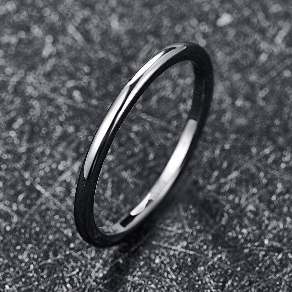 Thin silver ring featuring a 2mm polished silver Tungsten band with domed profile.